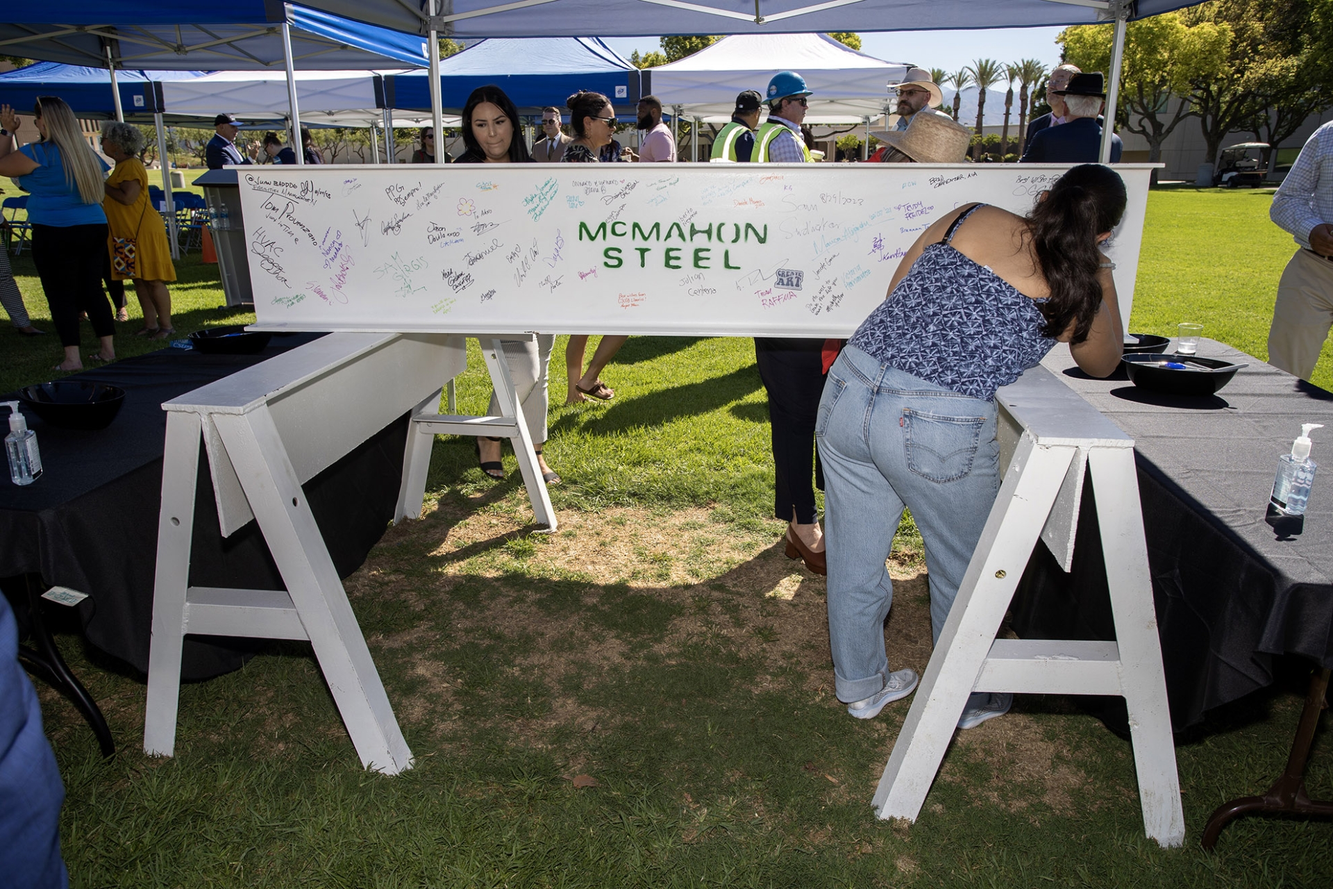 A student signing the beam