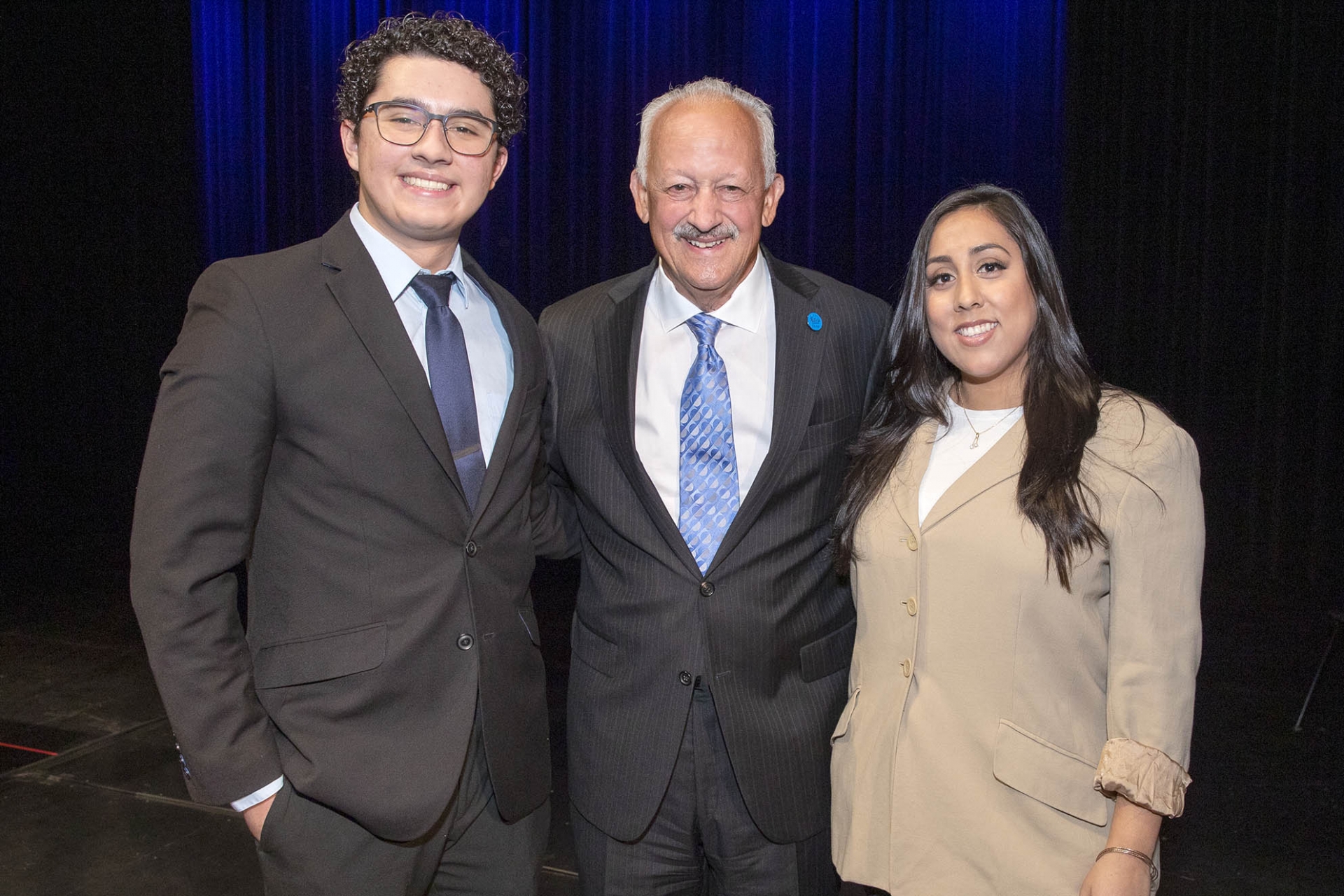 From left: Student speaker Jason Davalos, a PDC pre-nursing student, university President Tomás D. Morales, and Sarah Lopez, ASI vice president, Palm Desert Campus. 