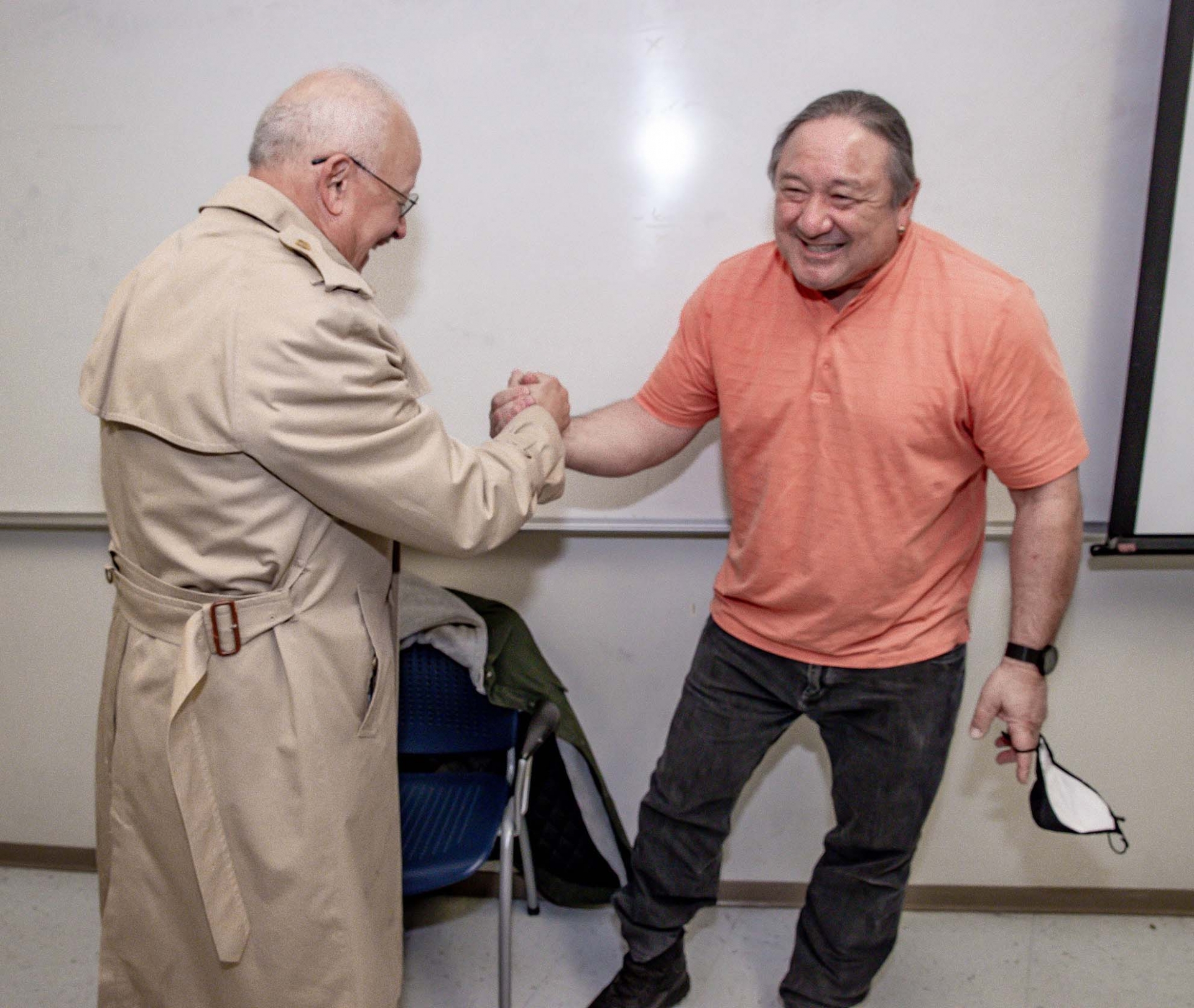 President Tomás D. Morales greets Stuart Sumida, the 2022-23 Golden Apple Award recipient.