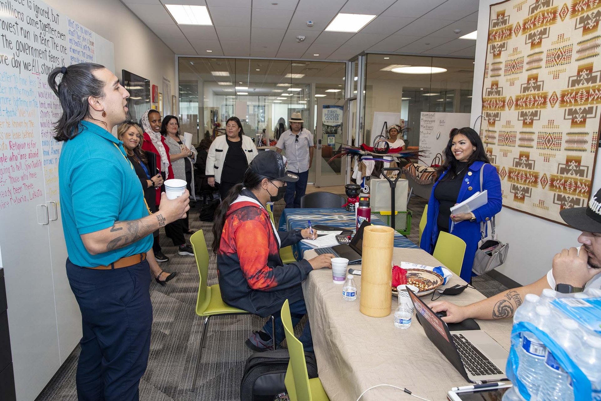 Carlos Two Bears Gonzales, far left, coordinator of CSUSB’s First Peoples’ Center coordinator, meets with CSU Student Trustee Diana Aguilar-Cruz, far right, during her visit to the center.