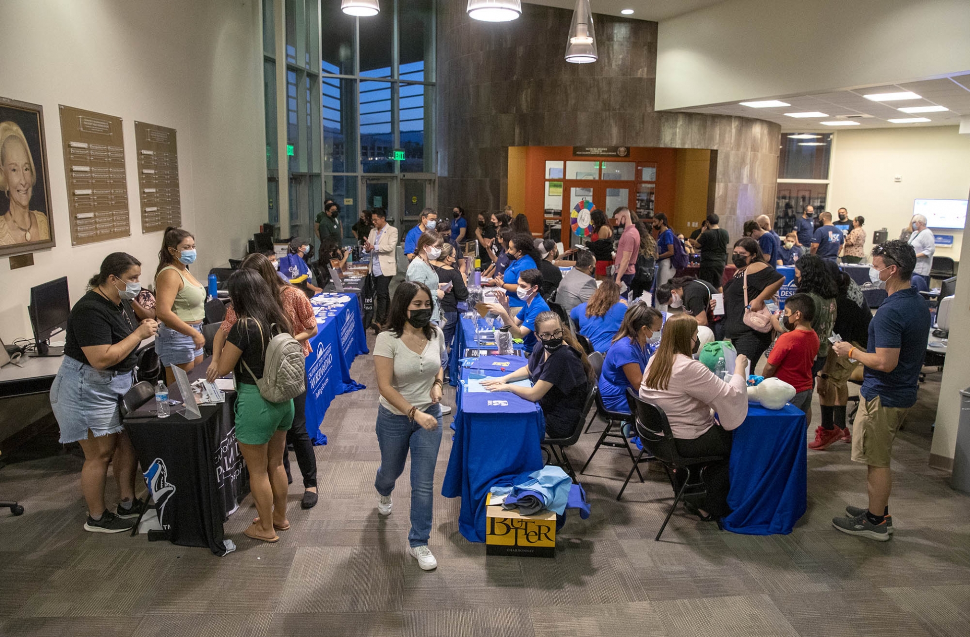 Students at the Resource Fair in the theatre lobby after the Convocation presentation.