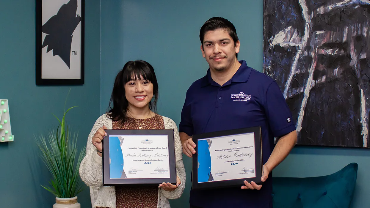 From left, Paola Godinez Martinez and Arturo Gutierrez, recipients of the Outstanding Professional Academic Advisor Award