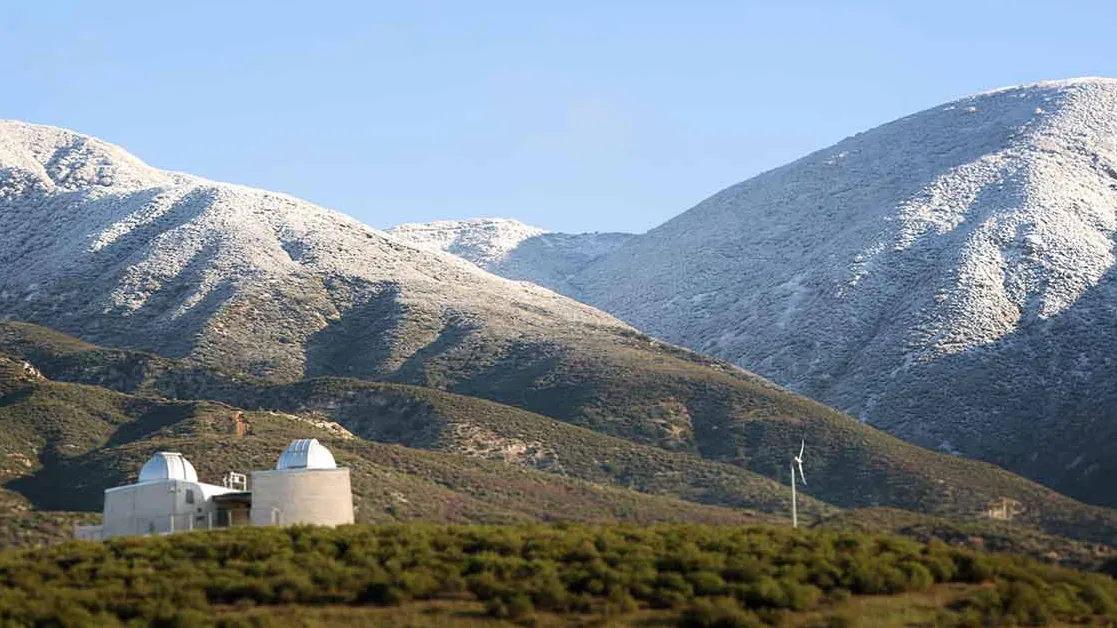Snow covers the mountains above CSUSB’s Murillo Family Observatory. The university will be closed Dec. 24-Jan. 1 for winter break.