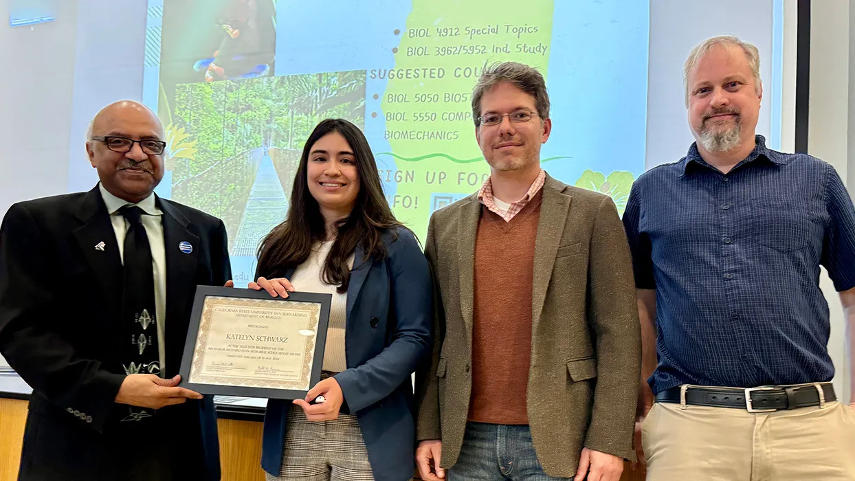 From left, Sastry G. Pantula, dean of the College of Natural Sciences; Katelyn Schwarz, scholarship recipient; Daniel Nickerson, associate professor of biology; and Jeremy Dodsworth, biology department chair. 