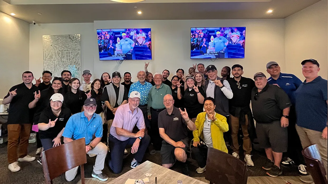 Marketing students and golfers pose at the 16th Annual Spring Classic Golf Tournament.