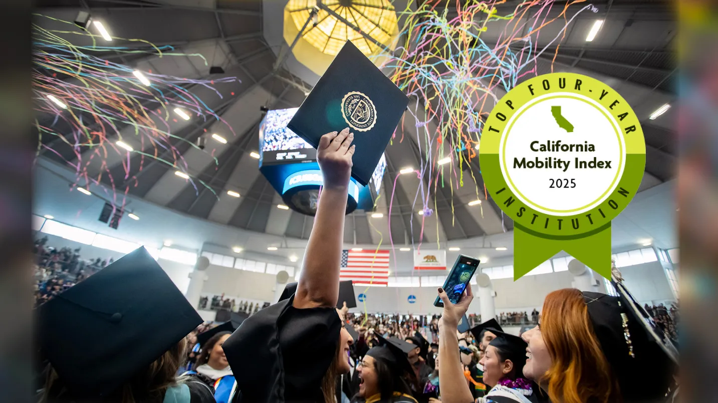 Student celebrating graduation at the CSUSB spirit letters with the College Futures Foundation California Mobility Index graphics badge.