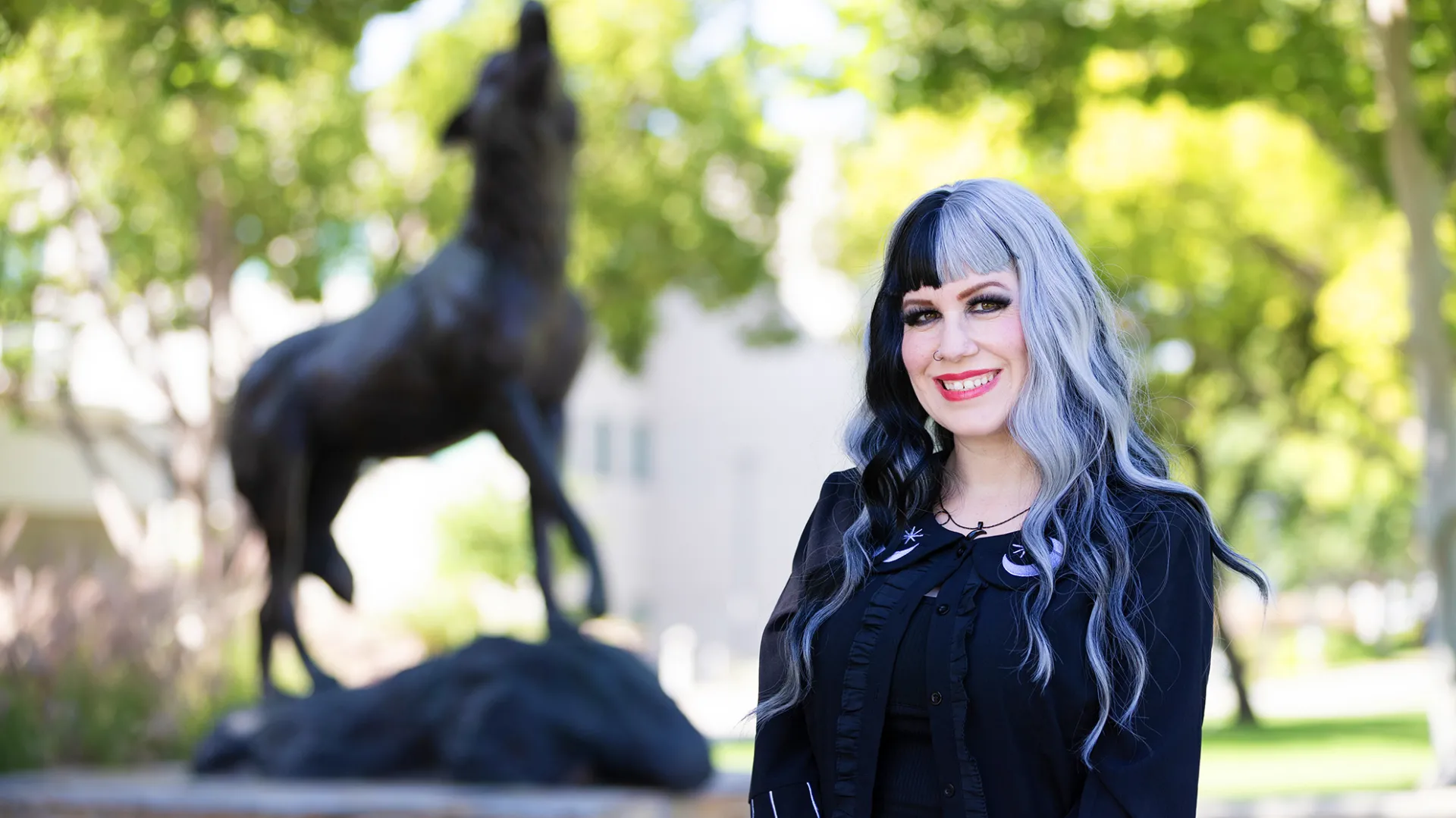 Jennifer Negrete Magnant at the Wild Song sculpture at CSUSB.