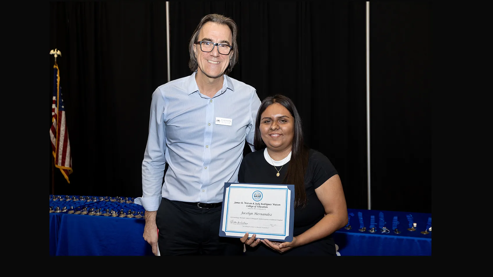 Jordi Solsona-Puig (left), assistant professor and co-coordinator of the Bilingual Authorization in Spanish program, and Jocelyn Hernandez-Rosales, the James R. Watson and Judy Rodriguez Watson College of Education’s 2025 Outstanding Bilingual Student.