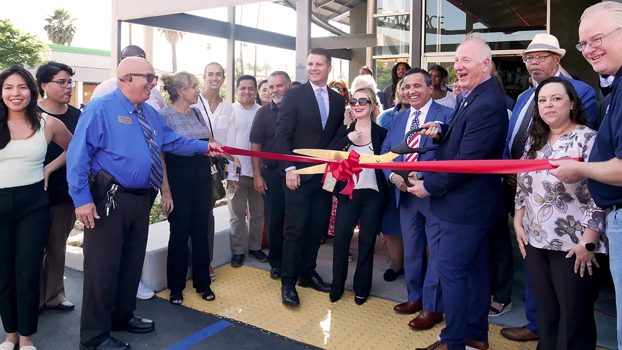 Community leaders and partners cut the ribbon to celebrate the expansion of Randall W. Lewis Center for Entrepreneurship's Riverside service location.