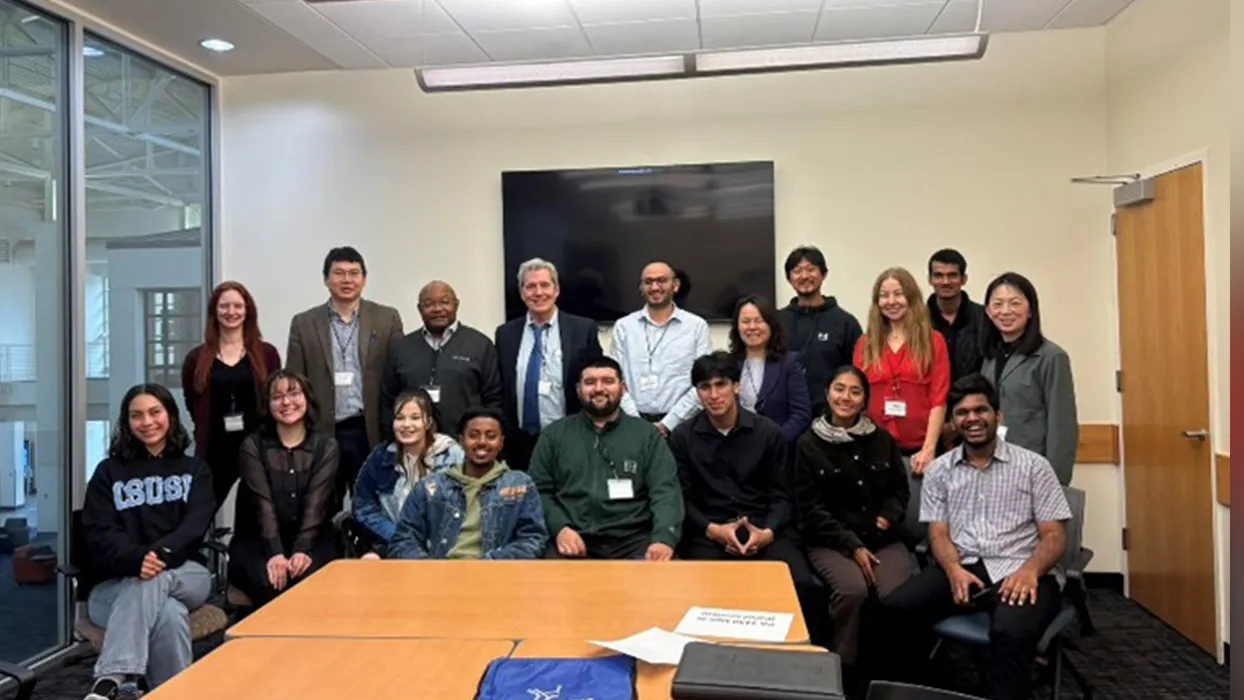 Members of the research team pose at a conference.