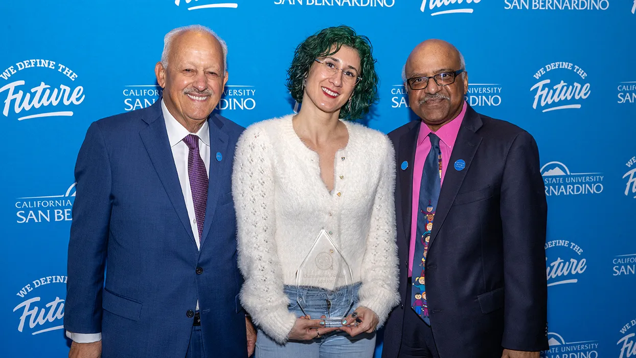 Lúa López, center, with CSUSB President Tomás Morales, left, and Sastry Pantula, dean of the College of Natural Sciences. She was named CSUSB’s 2024-25 Outstanding Faculty Advisor.