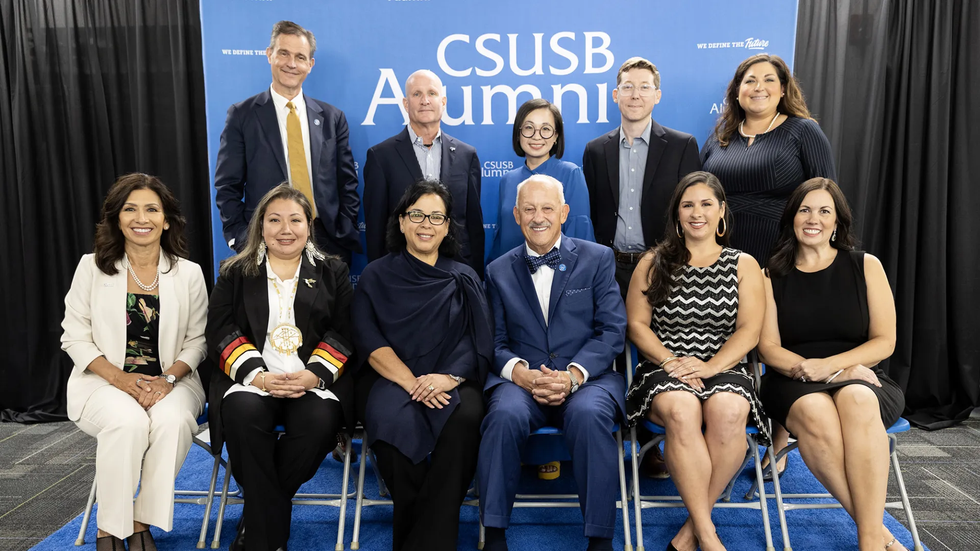 Back row from left, Raymond Watts, CSUSB interim vice president, University Advancement; Michael Bracken, Paw Print Award winner; Sapira Cheuk, Paw Print Award winner; Adam Huttenlocker, Paw Print Award winner; and Crystal Wymer-Lucero, director, CSUSB Alumni Relations. Front row from left, Miki R. Inbody, Paw Print Award winner; Laurena Bolden, Paw Print Award winner; Diana Z. Rodriguez, Distinguished Alumni Award winner; CSUSB President Tomás D. Morales; Natalie Hale, Coyote Spirit Award winner; and Miran