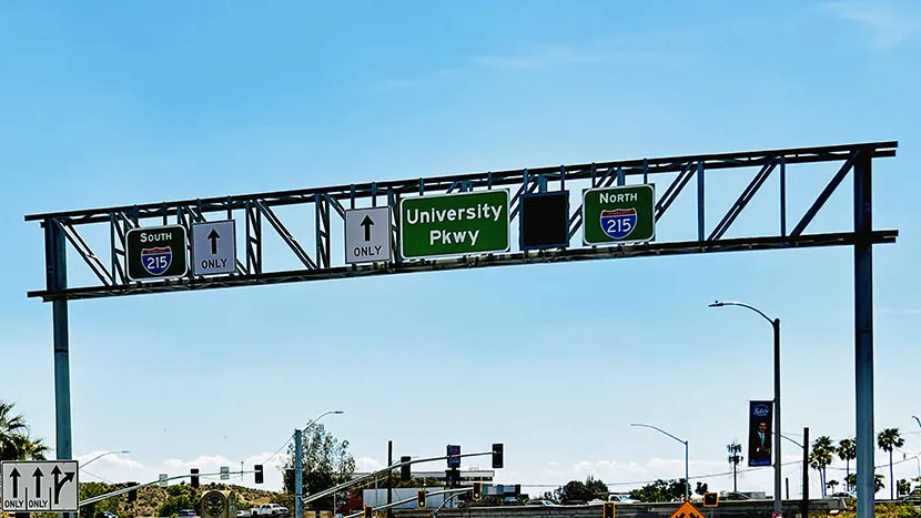 Traffic signage at University Parkway-Interstate 215 interchange, looking south toward the freeway overpass.