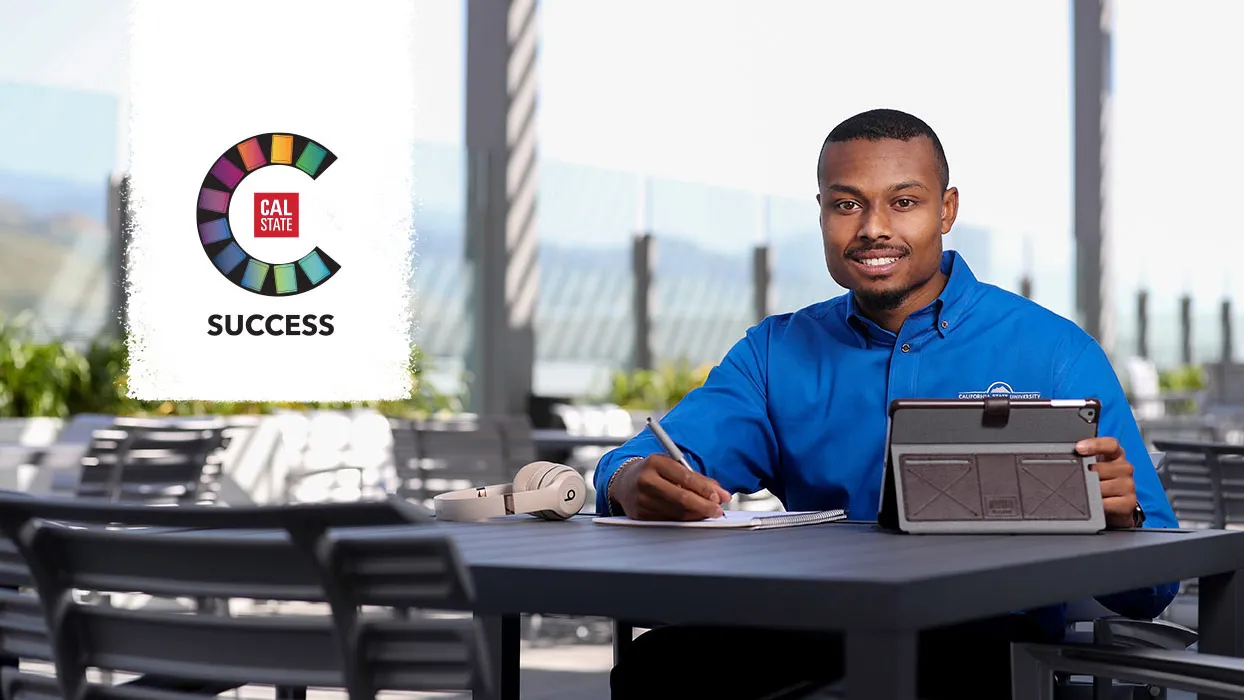 Student at a table with a laptop computer and the CSUCCESS logo