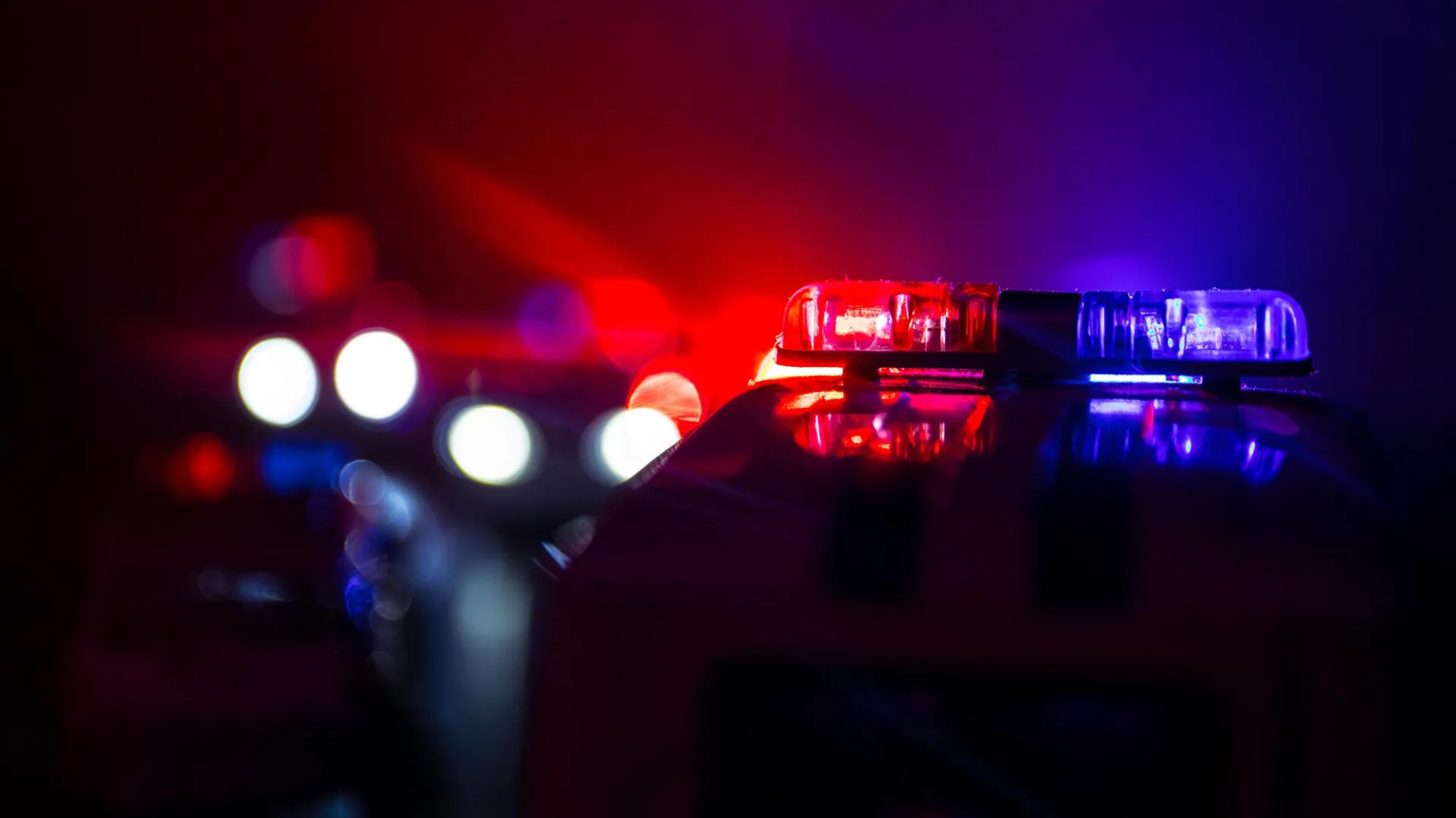 Photo of police lights at night.