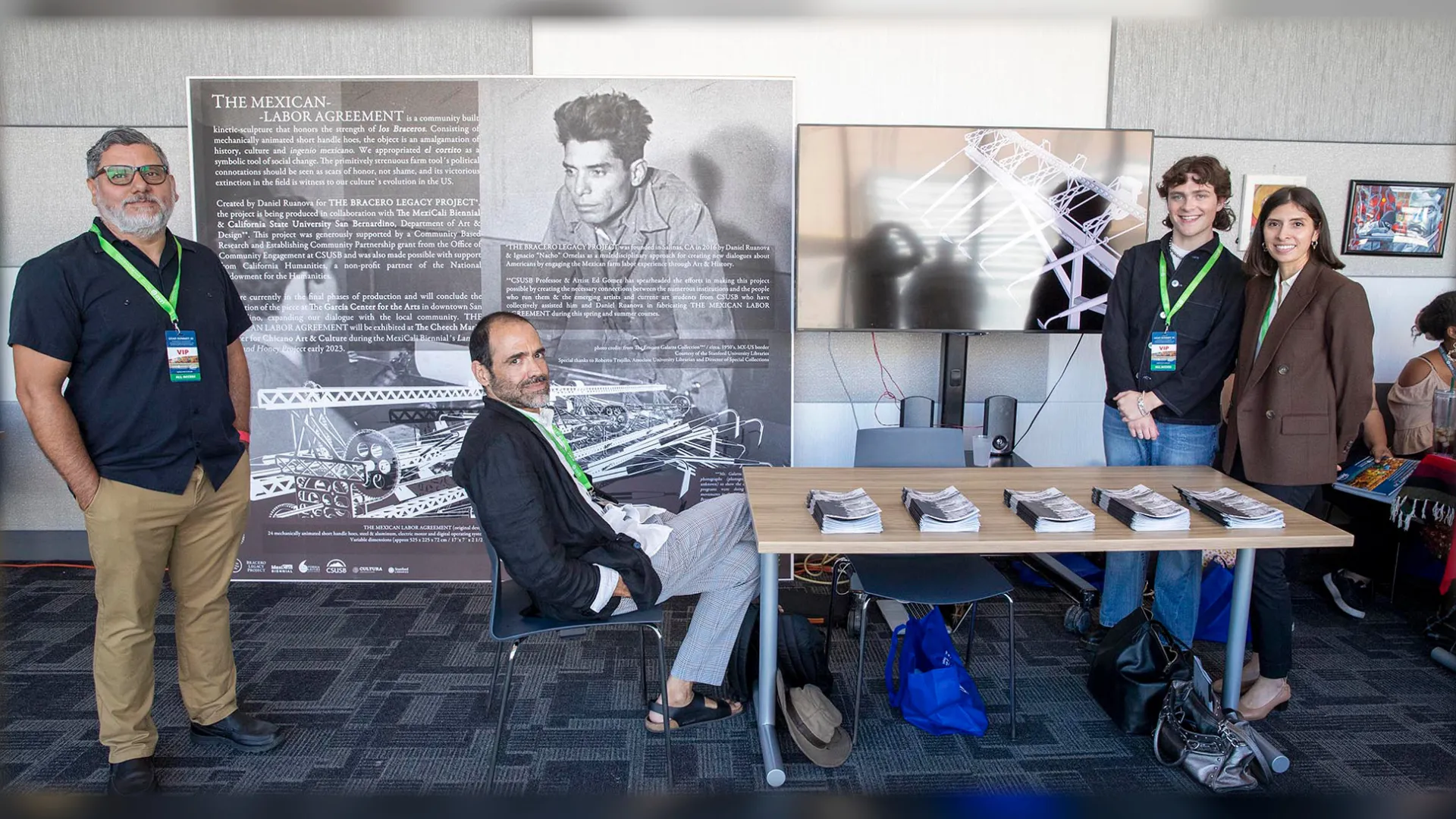 From left to right: Edward Gomez, CSUSB associate professor of art, artist Daniel Ruanova, Samuel White and Rosalia Romero, both from Pomona College, at the display of the LEAD Summit XI’s featured exhibit.