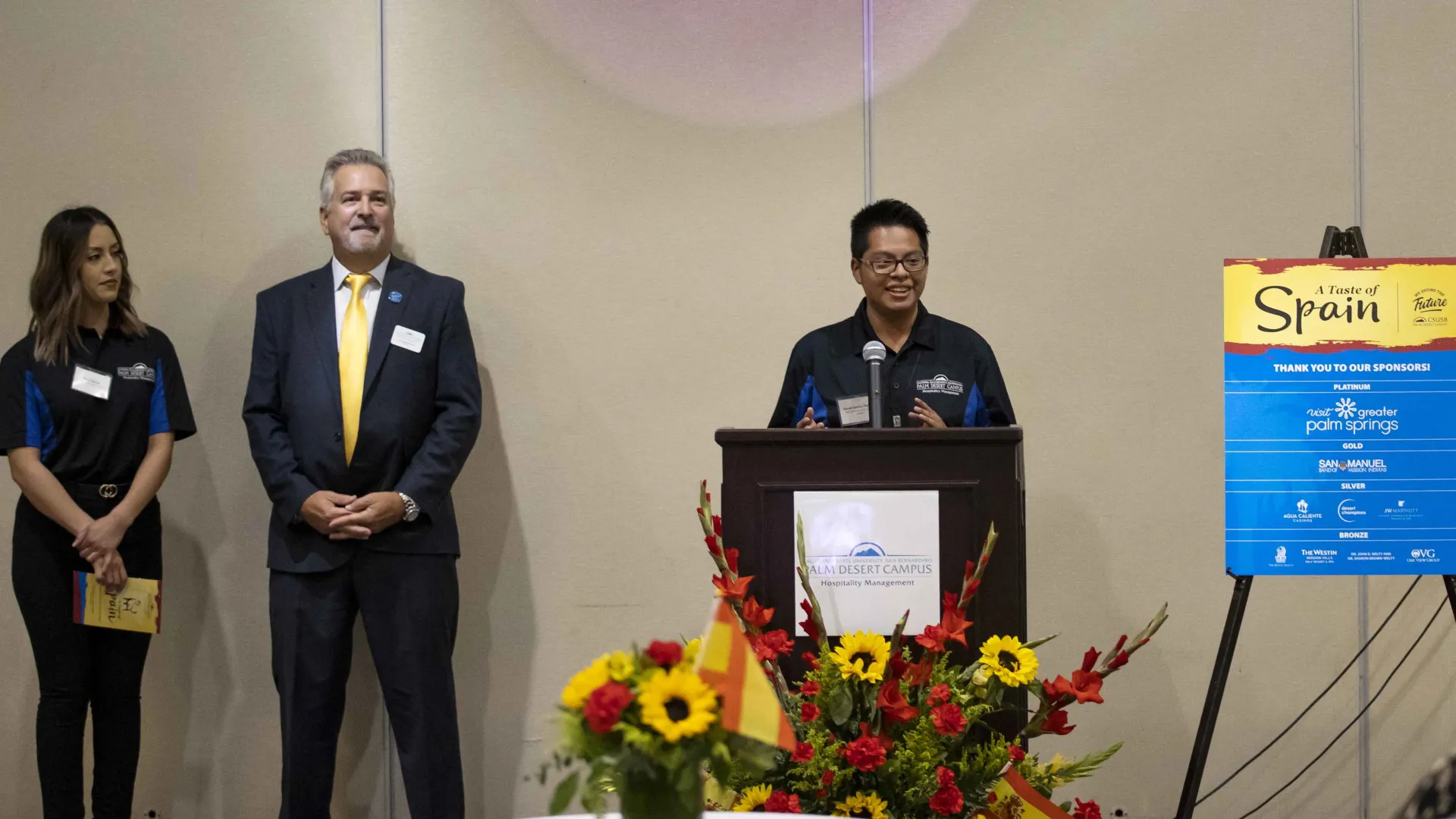 Student speaking at “A Taste of Spain” event.