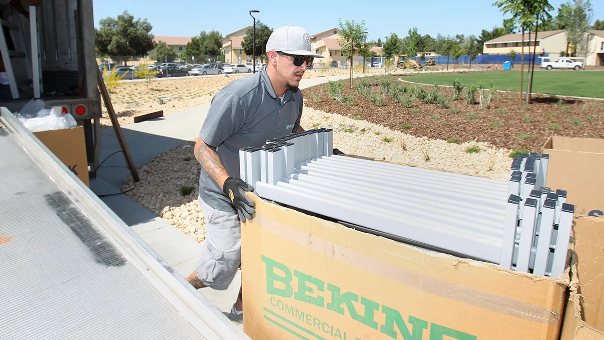 mover delivering furniture to student housing