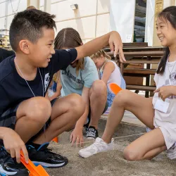 Young participants enjoy the archaeological dig activity at the Kids Discover Workshop, hosted by CSUSB’s Robert and Frances Fullerton Museum of Art, in July.