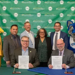 Kevin Horan, from bottom left, president of Crafton Hills College, and David Dufault-Hunter, vice president of CSUSB’s Strategic Enrollment Management and Marketing Division, signed a memorandum of understanding outlining the Coyotes on the Horizon partnership during a ceremony at Crafton Hills College on April 17. Administrators from both institutions were present, showcasing their support of the groundbreaking program.