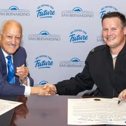 CSUSB President Tomás D. Morales (left) and Navy Capt. Joseph Burgon, commanding officer at NSWC Corona, signed the Education Partnership Agreement on May 5.
