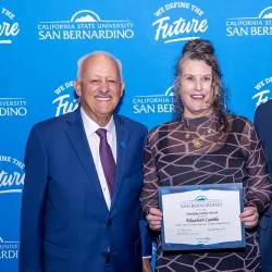 During the June 30 Faculty Recognition Luncheon, CSUSB President Tomás D. Morales (left) presented the 2025 Emerging Scholar Award to Elizabeth Castillo, who is also posed with Tomás Gomez-Arias, dean of the Jack H. Brown College of Business and Public Administration.