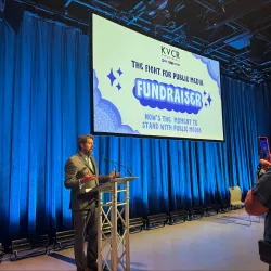 Thomas Corrigan, professor of communication and media, speaking at a recent fundraising event for the local public broadcasting station, KVCR.