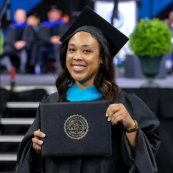 A graduate celebrating at CSUSB’s Jack H. Brown College of Business and Public Administration Commencement ceremony held last May. 