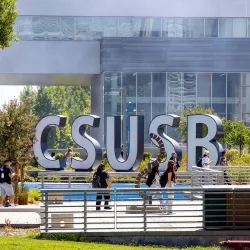 Students make their way past the CSUSB spirit letters