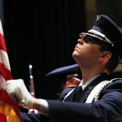 Soldier holding flag.