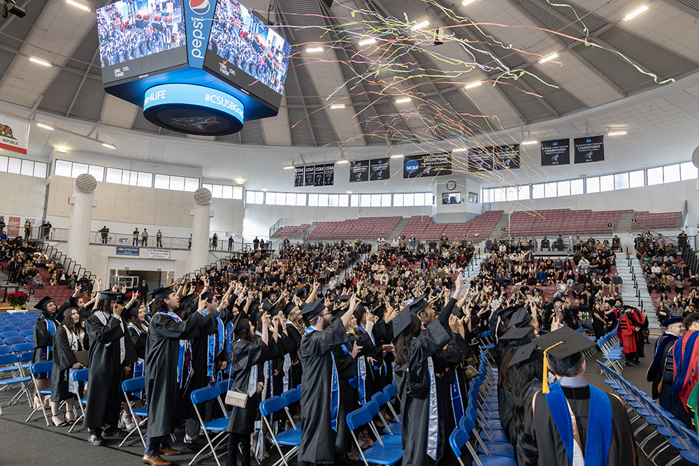 Graduates celebrate earning their degrees at the Coussoulis Arena in front of family and friends.