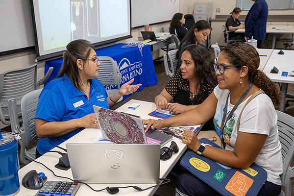 A CSUSB admissions counselor meets with students to discuss their eligibility for spring 2025 at Norco College. 