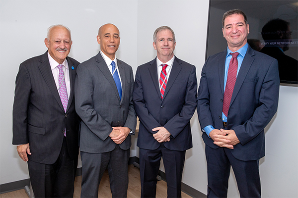 From left, CSUSB President Tomás D. Morales; White House Deputy National Cyber Director Harry Wingo; Dr. Tony Coulson, executive director of CSUSB’s Center for Cyber and AI; Dr. Vincent Nestler, director of CSUSB’s Center for Cyber and AI.