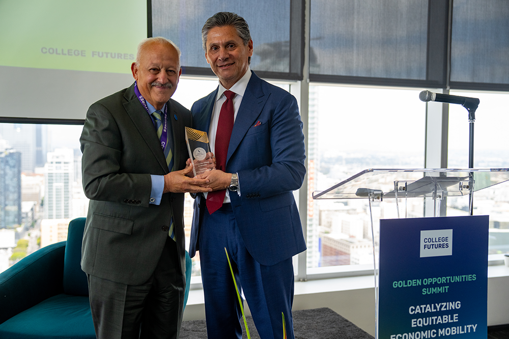 CSUSB President Tomás D. Morales (left) accepts an award from Eloy Ortiz Oakley, president and CEO of the College Futures Foundation at the foundation’s Golden Opportunities Summit in the spring. The foundation ranked CSUSB No. 6 on its Four Year California Mobility Index