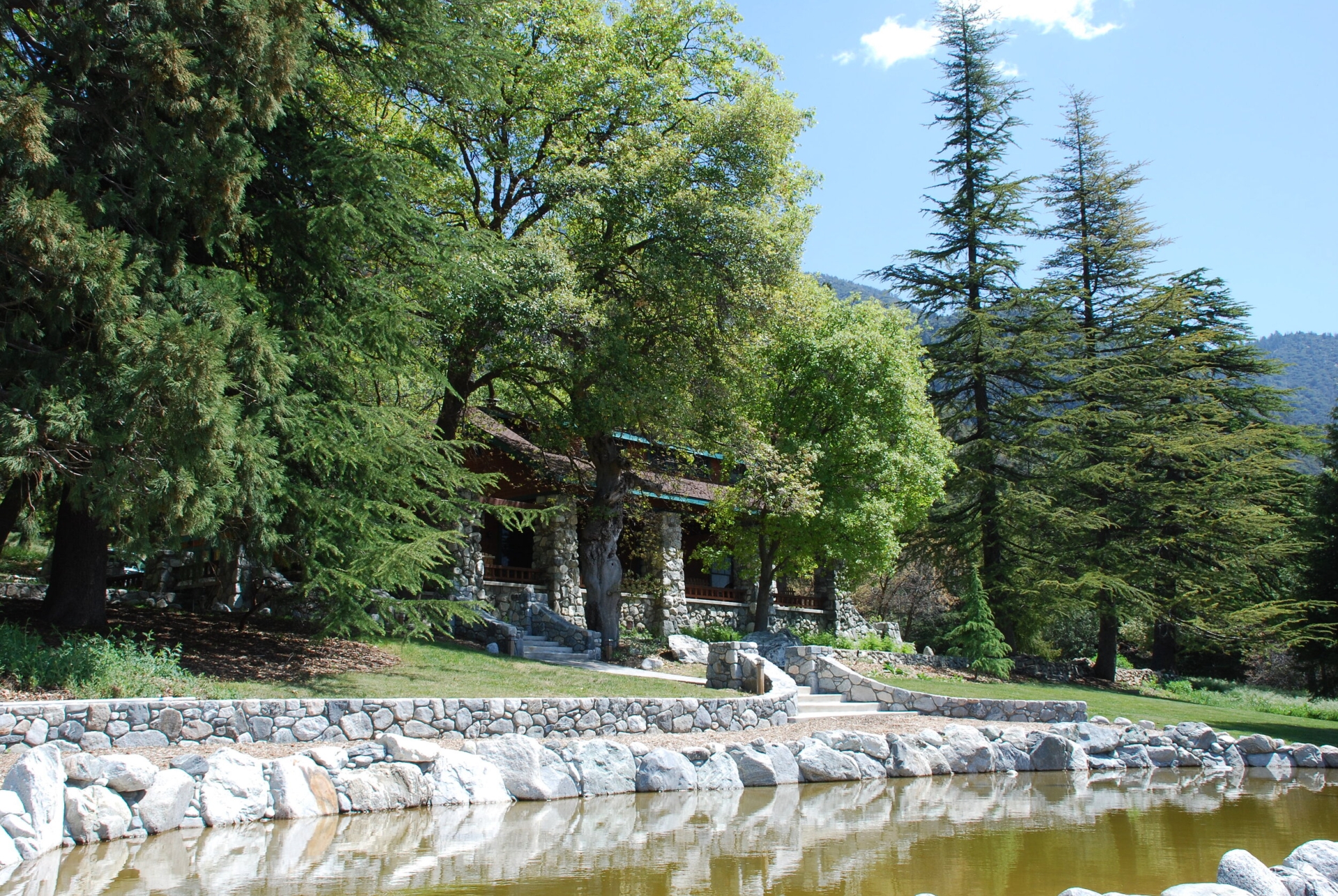 stone cabin by pond