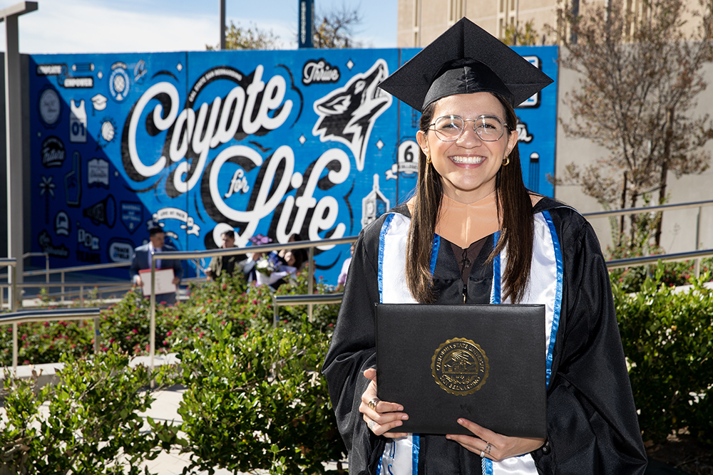 A graduate beams with pride at the Jack H. Brown College of Business and Public Administration ceremony. 