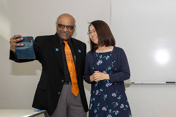 College of Natural Sciences Dean Sastry Pantula invited Zhang to take a selfie with him during the surprise award recognition, which delighted her students and attending colleagues and staff.