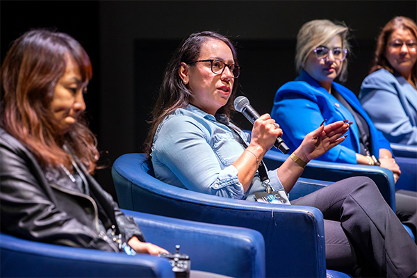 Dora Mejia, CSUSB emergency manager and two-time alumna, at center, discussed how AI was impacting emergency preparedness and public health.