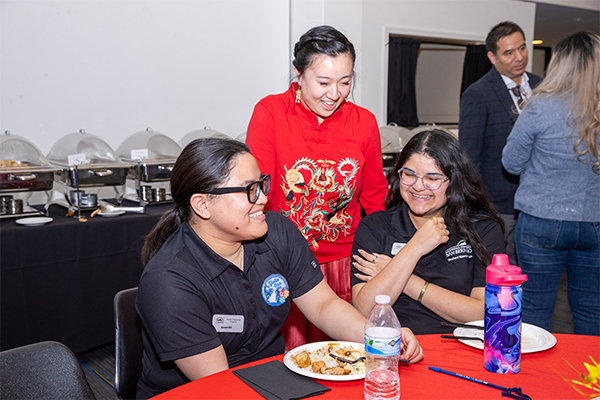 From left, Ananda Chanatangcharoen CSUSB student; Li, Yotie Oso Undergraduate Retention and Success Program advisor; and Nayab Sanchez, CSUSB student, enjoyed the shared meal during the Lunar New Year Celebration.