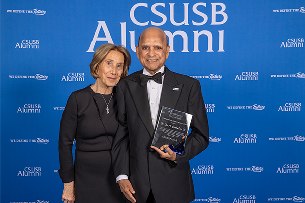GnanaDev (right) received the Distinguished Alumni Award at the 2025 Hall of Fame Awards.