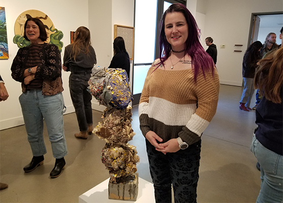 Mya Correa with one of her sculptures on display at the second-year MFA exhibition held in January.