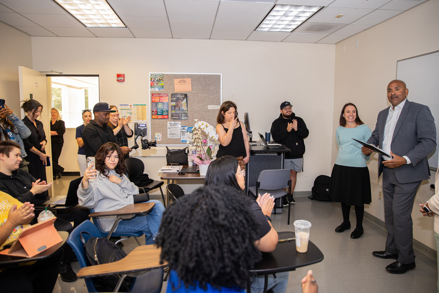 Rafik Mohamed, provost and vice president of Academic Affairs, congratulates Liszka.