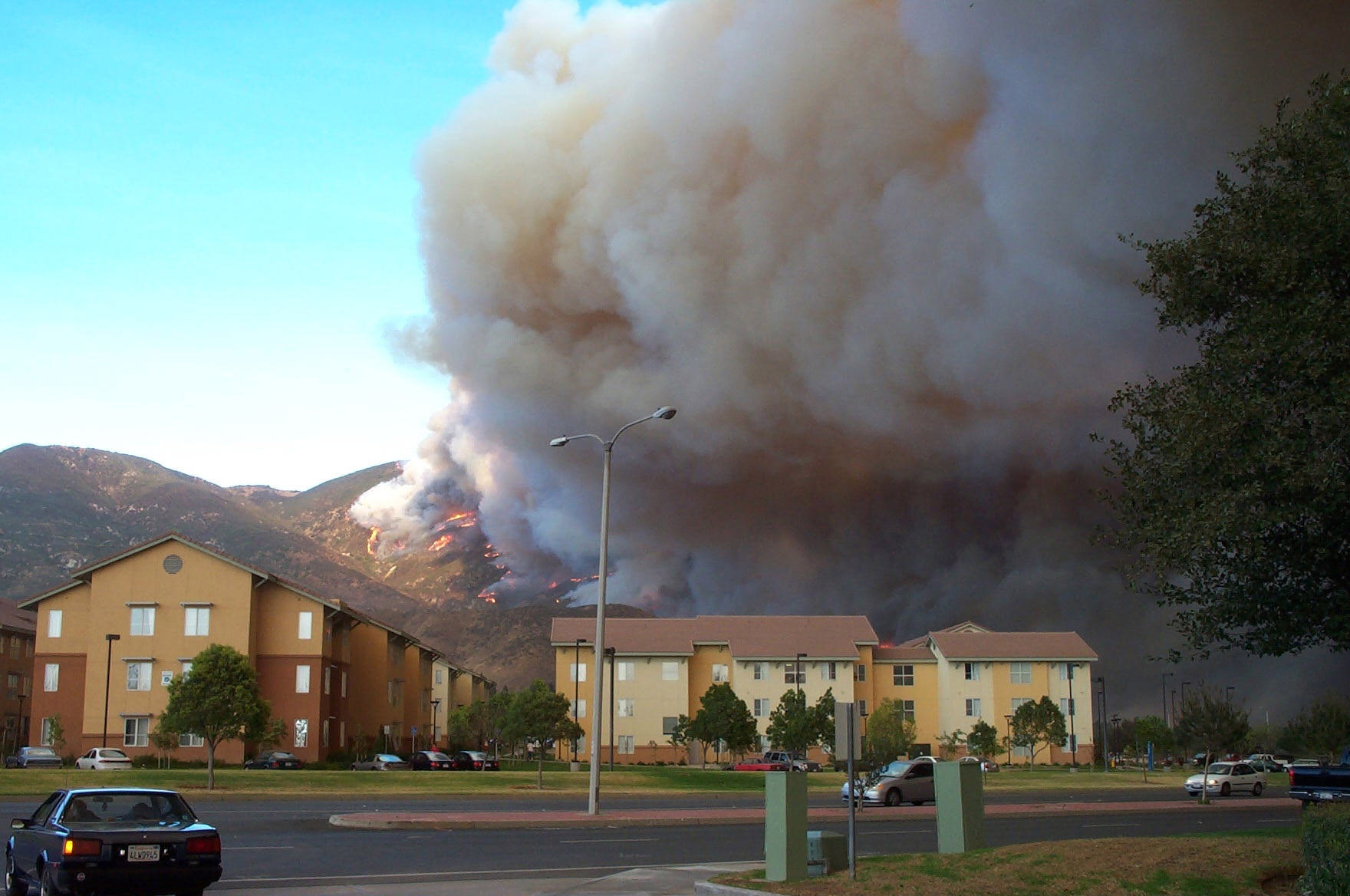 Smoke and flames from the Old Fire in the foothills behind CSUSB destroyed a modular building and damaged two others on campus.